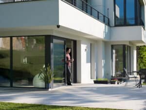 person standing in glass back door